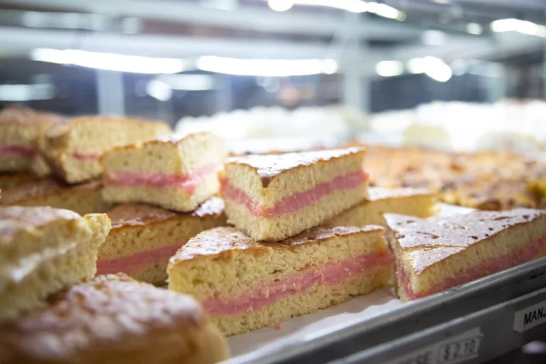 Layered cake slices with pink filling at Diana’s Bakery STL in St. Louis